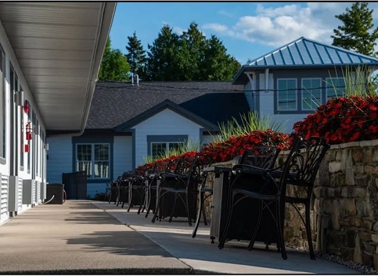 View from parking lot level walkway toward main registration office entrance and food area